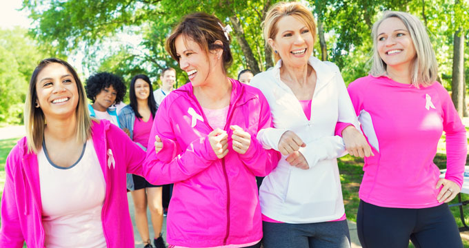 Women in pink celebrating Breast Cancer awareness.