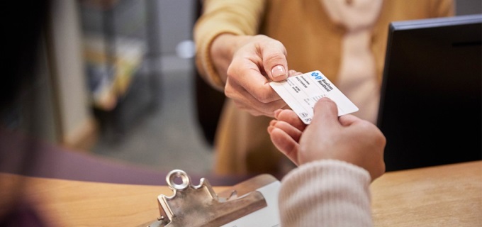 Member presenting BCBTX Member ID card